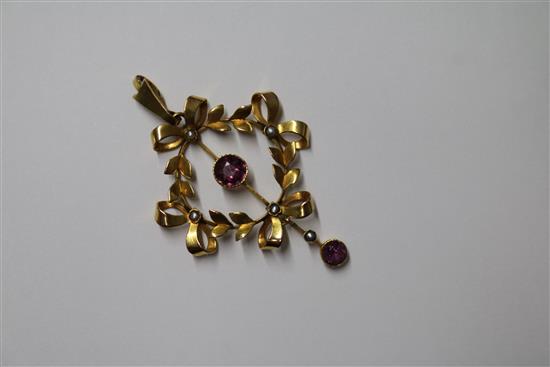 An Edwardian gold openwork pendant set amethyst and pearl, a peridot set pendant and a 15ct gold and turquoise heart pendant